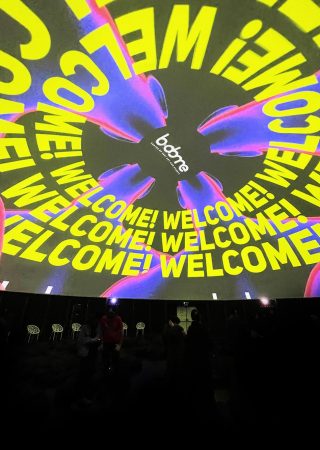 Colourful screening on the roof of the geodesic dome event space.